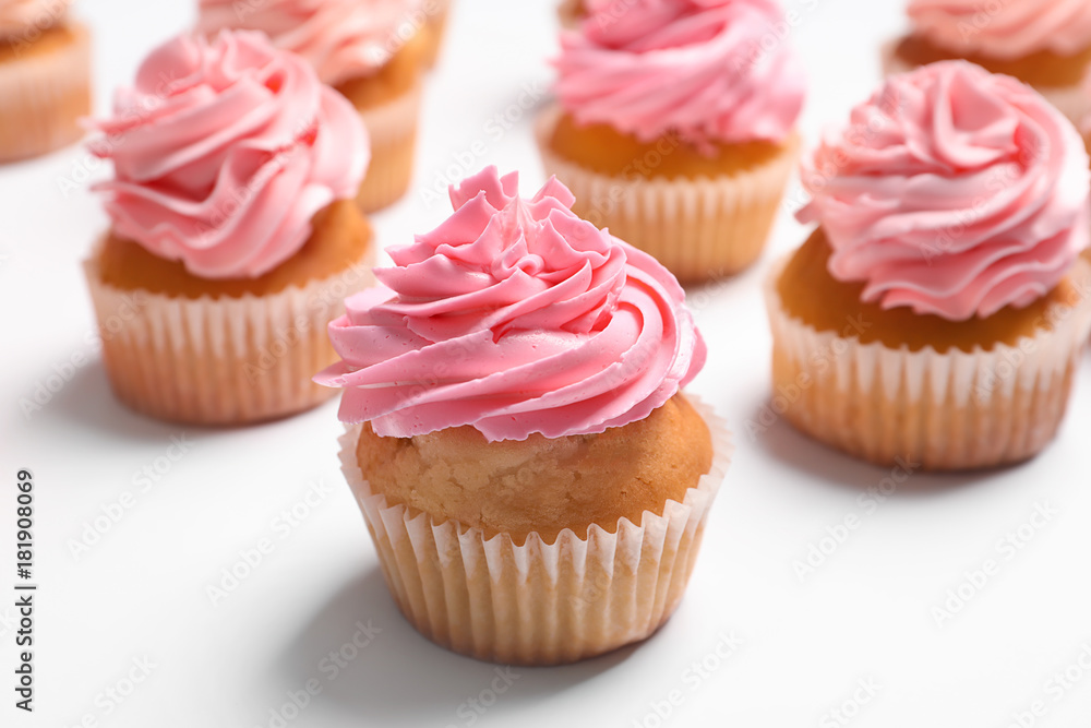 Many yummy cupcakes on white background