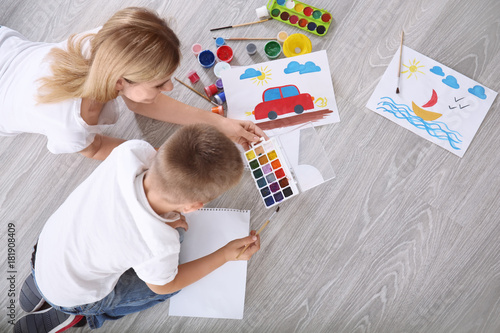 Mother with cute boy painti...