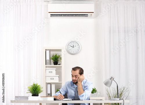 Young man working in office...
