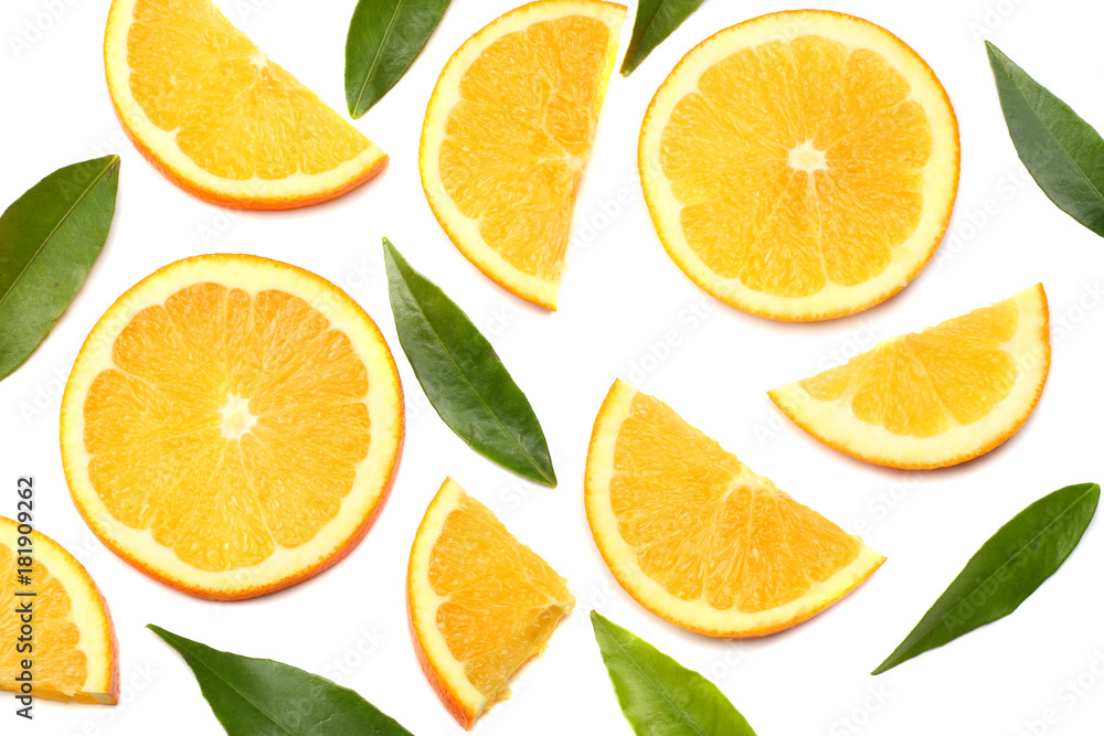 Fototapeta premium orange with slices and green leaf isolated on white background top view