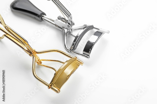 Eyelash curlers on white background