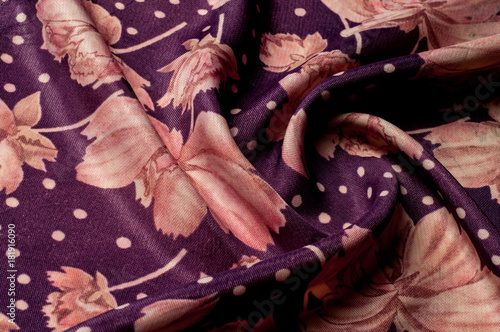 Texture, background, pattern. Silk fabric of lilac color. With painted peony flowers