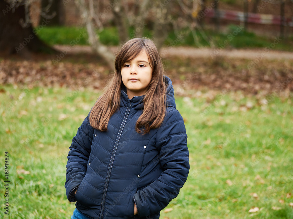 A beautiful girl in the park on a fall day A beautiful girl in the park on a fall day