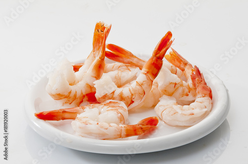 Jumbo Head Less Cooked prawns on white plate on white background