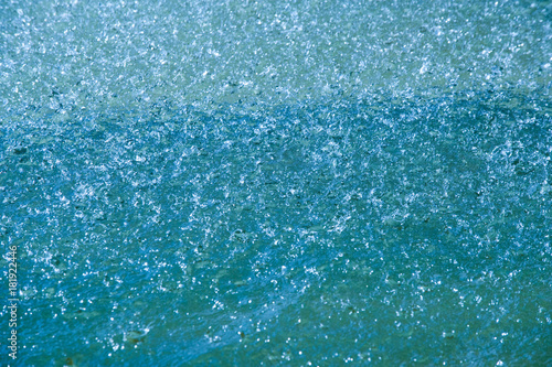 Texture, background, pattern. Water in the pools, spray from the fountain. Water pool fountain spouting vertical high geyser shoot spray sprinkle feature decoration