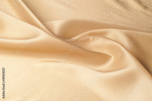 Texture, background, pattern. Silk Dupioni Fabric by the yard in a golden beige color