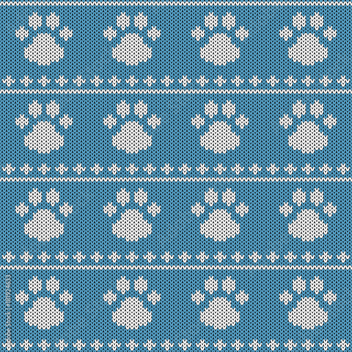 Abstract knitted dog paw seamless pattern background. Knit texture for design new year card, christmas invitation, holiday wrapping paper, winter vacation travel and ski resort advertising etc.