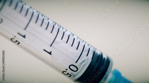Close-up of syringe during injection drugs or medecine. 4K UltraHD video photo