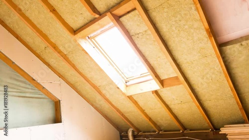 house attic under construction mansard wall insulation with rock wool