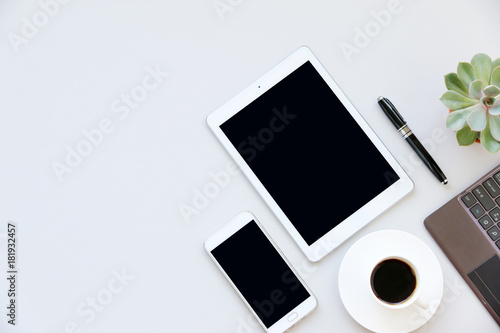 Office table with tablet,keyboard,smartphone,pen and cactus, copy space,Top view, flat lay