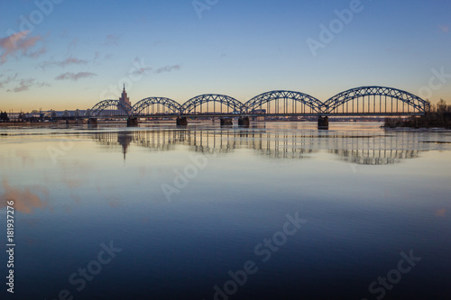 Stunning cloudy sunset at bridge at Riga, Latvia