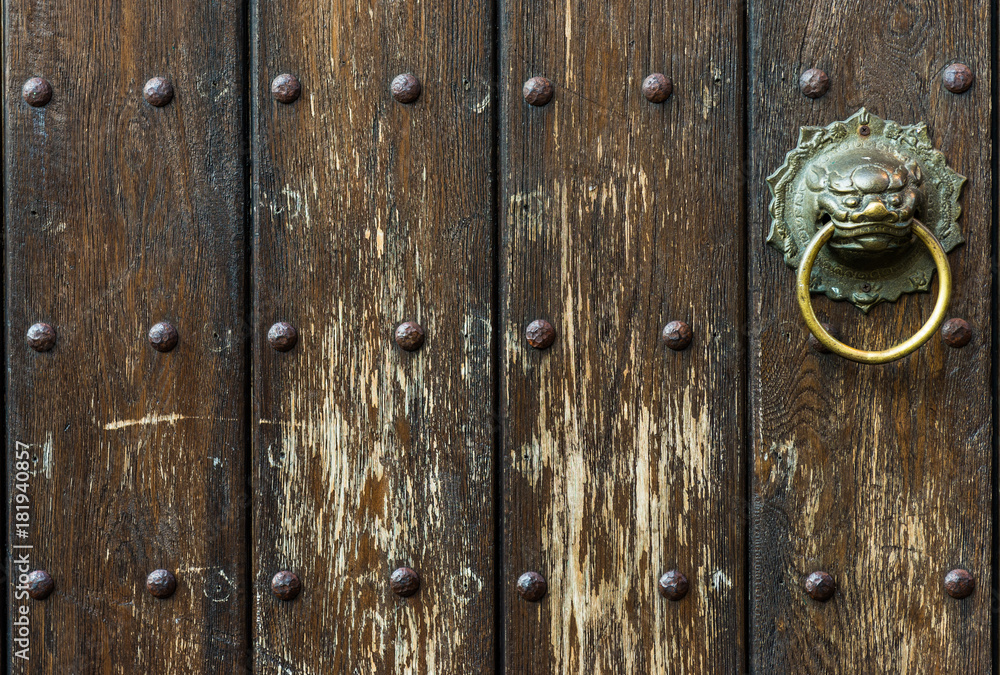 Fototapeta premium Asian style antique solid wooden door with Knocker