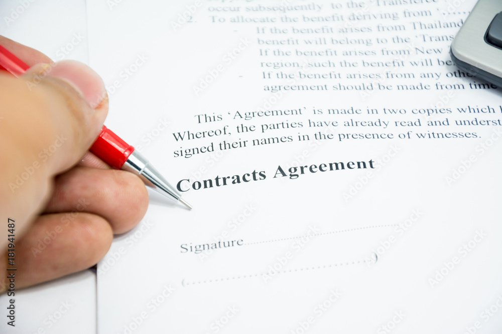 contracts agreement sign on document paper with red pen contracts agreement sign on document paper with red pen