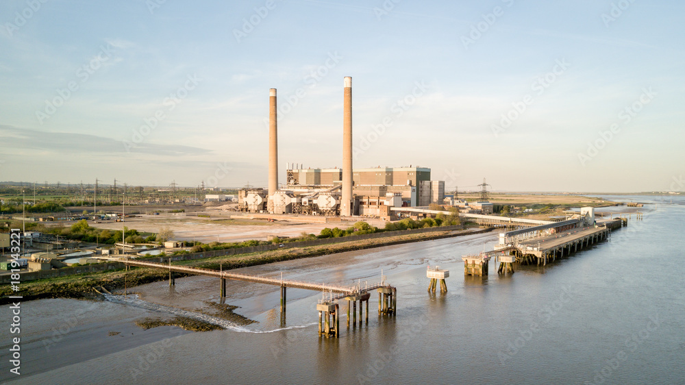 Naklejka premium Tilbury Power Stations, Essex, UK. The decommissioned Tilbury A and B fossil fuel power stations on the banks of the River Thames estuary, England.