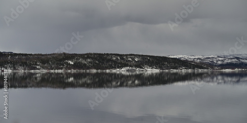 Reflection of mountain in water, Saltdal Fjord, Norway photo