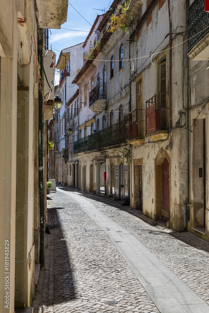 Old Narrow Street in Portuguese Town in a Sunny Day