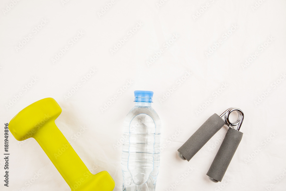 Sports equipment with bottle of water on a white background top view Sports equipment with bottle of water on a white background top view