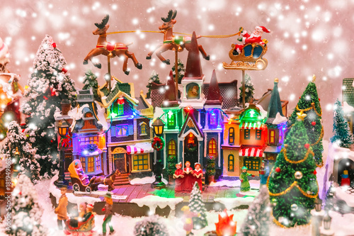 Santa Claus, Christmas tree and toys at a Christmas souvenir market shop in Strasbourg, Alsace, France
