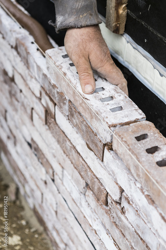 macon placing bricks close up