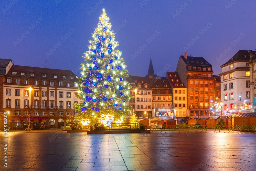 Christmas Tree Decorated and illuminated on the Place Kleber in Old Town of Strasbourg at night, Alsace, France