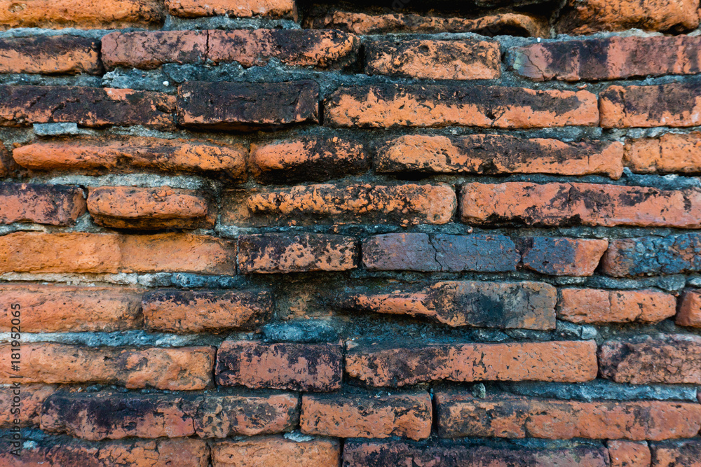 Naklejka premium Old damaged brick wall