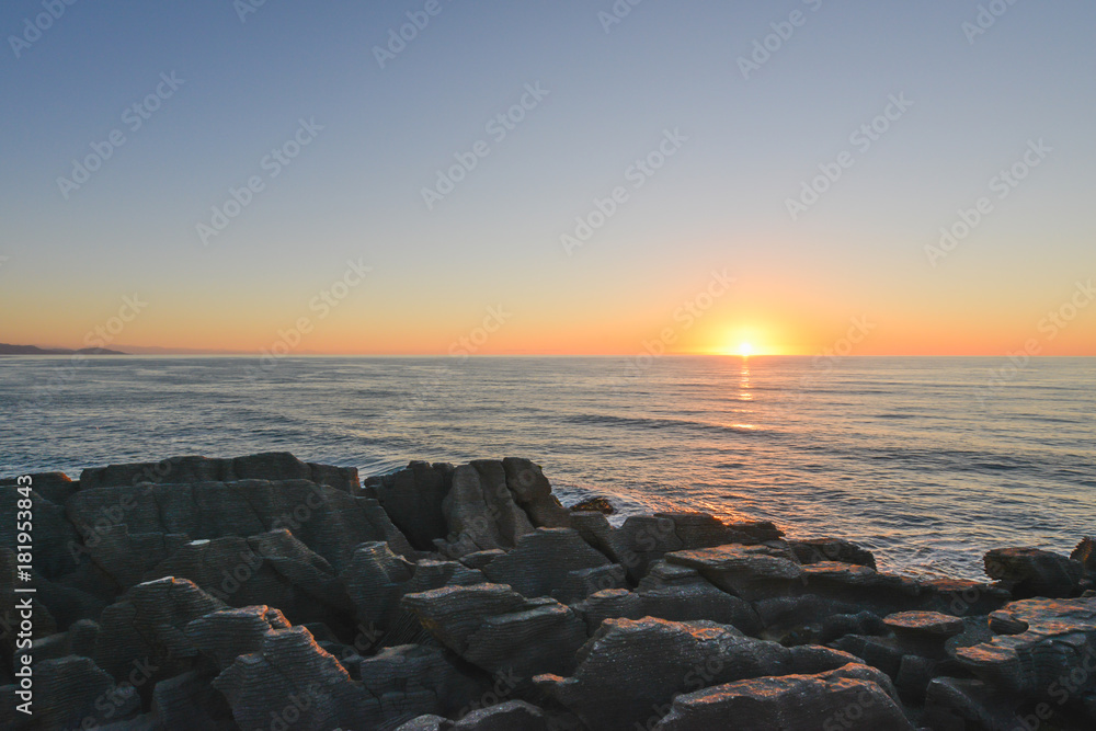 Sunset at Pancake Rocks Punakaiki at New Zealand, Southland Sunset at Pancake Rocks Punakaiki at New Zealand, Southland