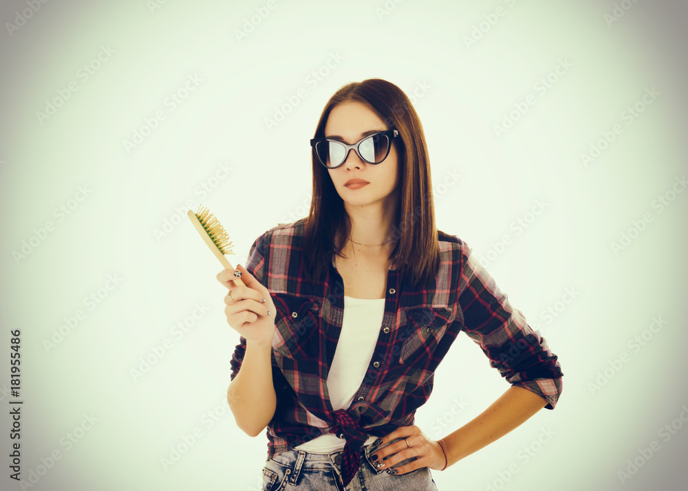 Young cute girl with hairbrush Young cute girl with hairbrush