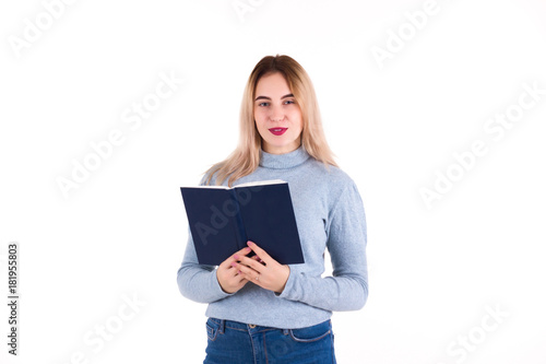 Young cute girl reads a book, isolated 