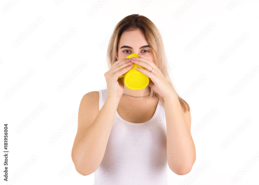 Young cute woman drinks coffee or tea, isolated Young cute woman drinks coffee or tea, isolated