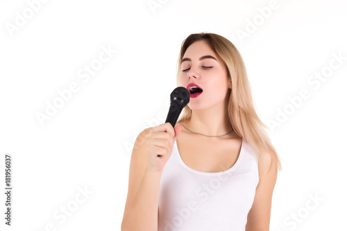 Young cute girl with microphone, isolated 