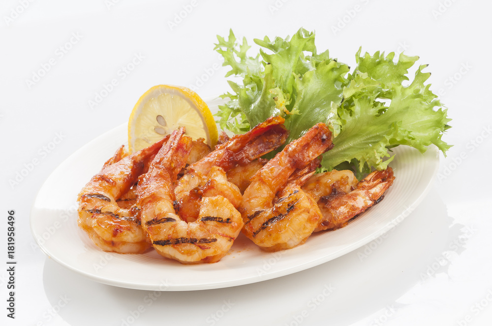 Grilled Jumbo headless shrimp with tikka marinade with lemon tomato and lettuce  