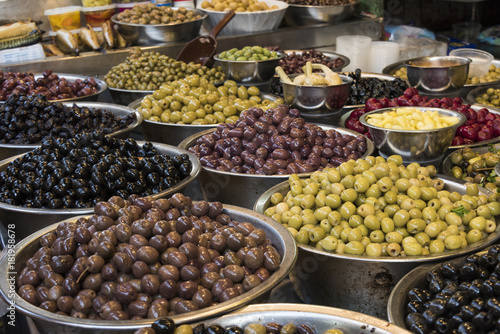 Variety of olives for sale at market stall, Carmel Market, Tel Aviv, Israel © klevit