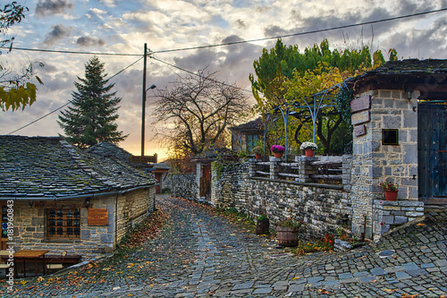 Obraz na płótnie Sunset on a traditional alley in Megalo Papingo village in Ioannina, Greece