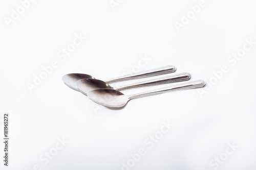 Teaspoons on a white background.