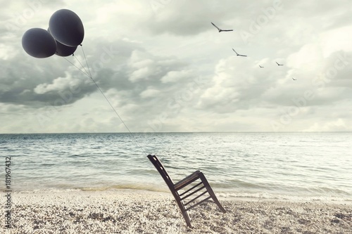 Fotografie, Obraz surreal image of a chair held in balance by flying balloons