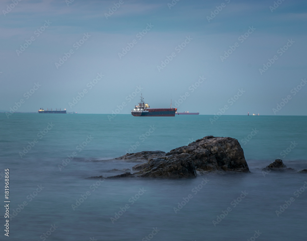 the turquoise Black Sea with the ships around the port of Burgas, Bulgaria