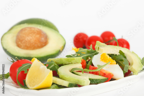 Fresh healthy sald with avocado  tomato  eggs and rucola lettuce