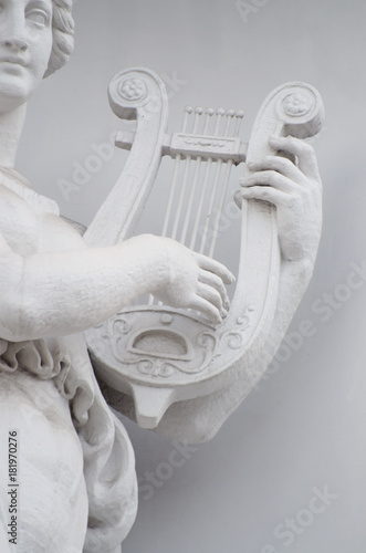 Sculpture of woman with lyre.