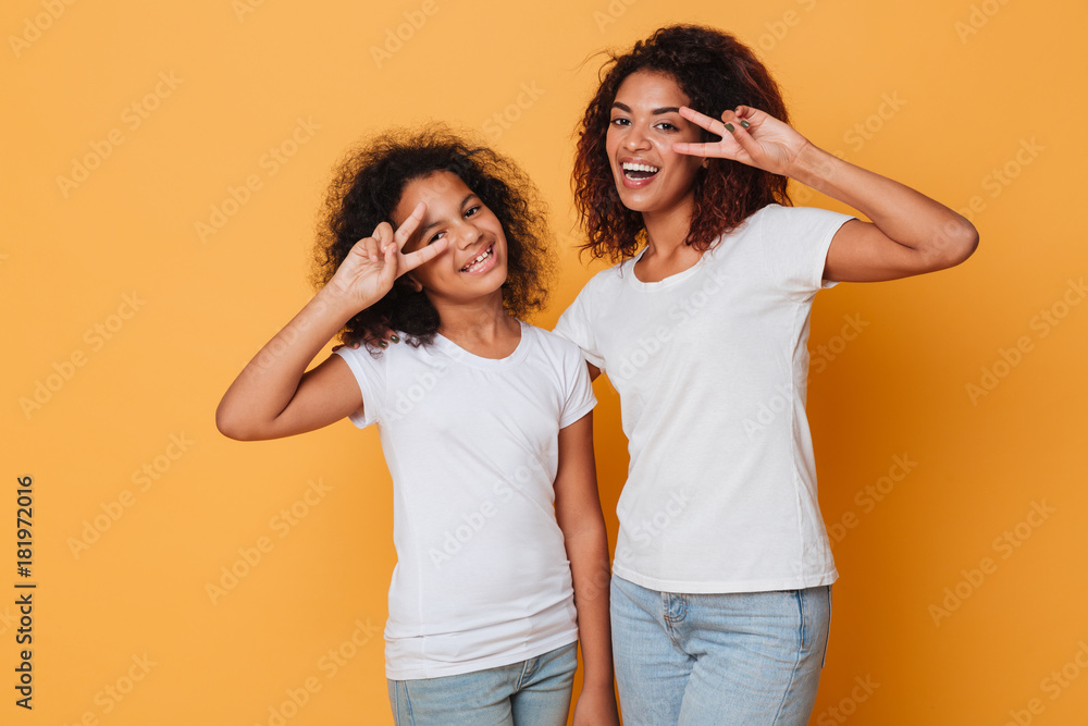 Portrait of two cheerful african sisters standing Portrait of two cheerful african sisters standing