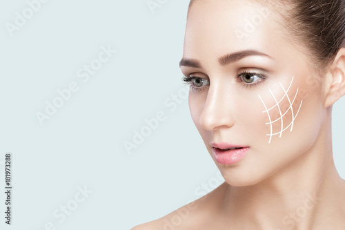 woman on grey background closeup. girl with clean skin