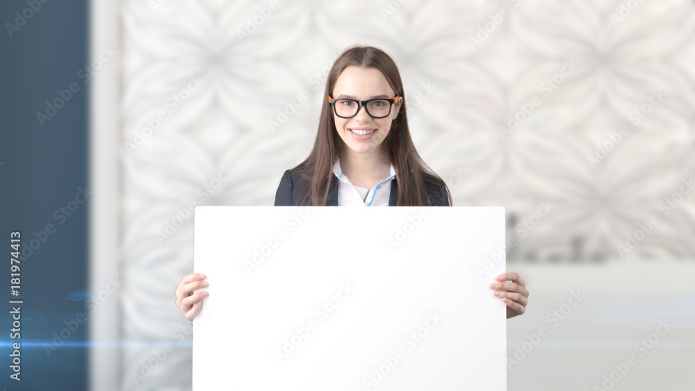 Young beautiful business woman and creative designer standing over blured interior background Young beautiful business woman and creative designer standing over blured interior background