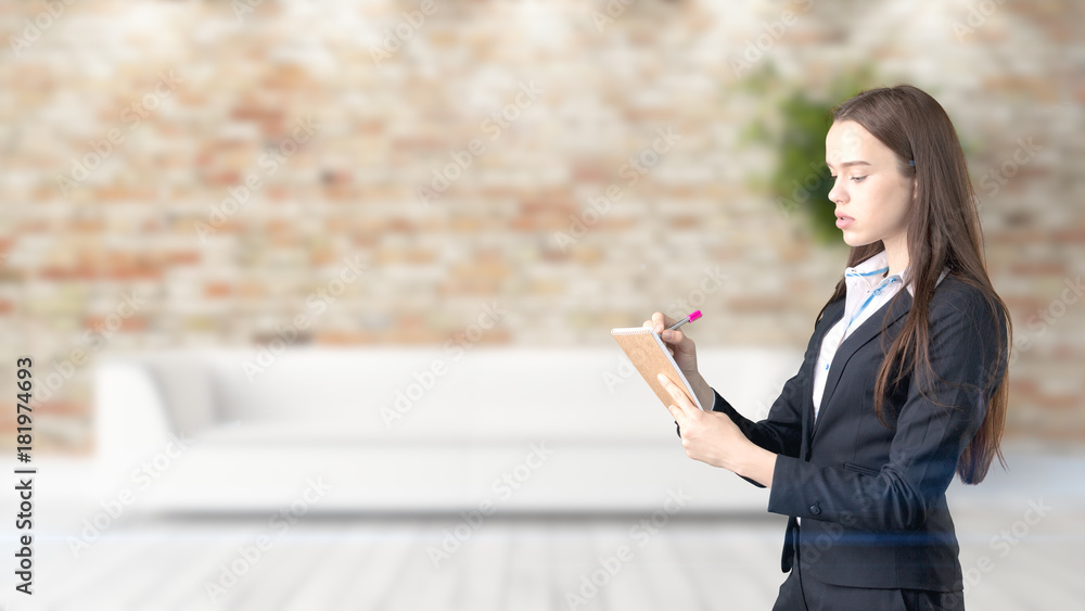 Young beautiful business woman and creative designer standing over blured interior background Young beautiful business woman and creative designer standing over blured interior background