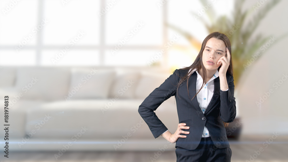 Young beautiful business woman and creative designer standing over blured interior background Young beautiful business woman and creative designer standing over blured interior background