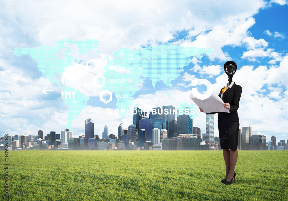 Camera headed woman standing on green grass against modern cityscape Camera headed woman standing on green grass against modern cityscape