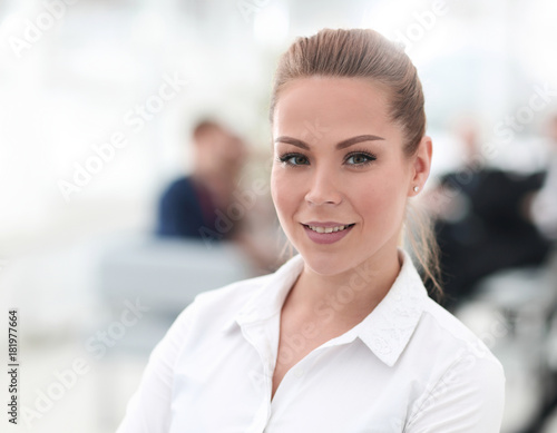 closeup portrait of successful business woman on blurred background office