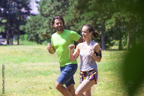 Healthy, fit and sportive couple running in park