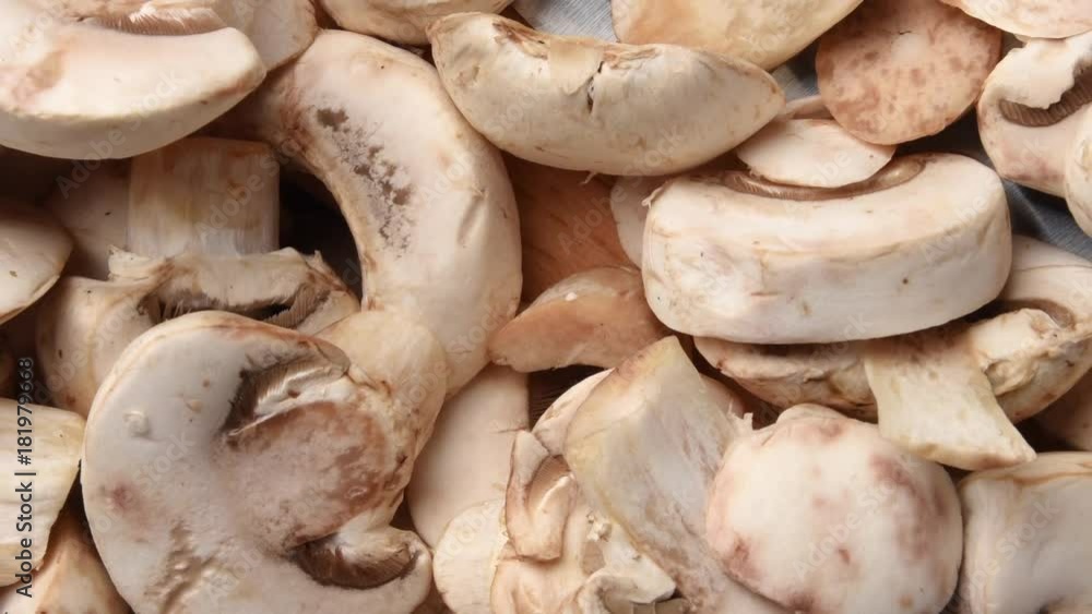 Overhead view of sliced button mushrooms Overhead view of sliced button mushrooms