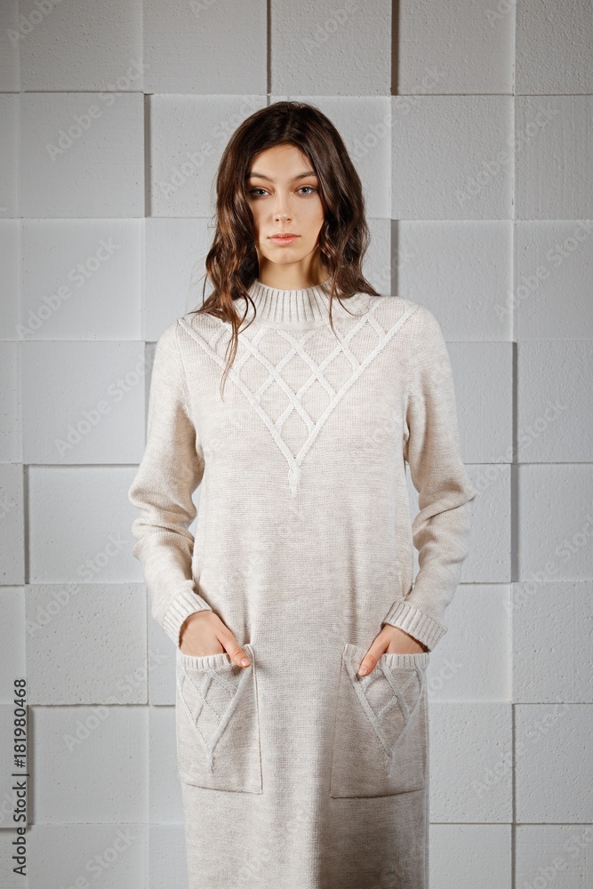 Attractive girl in long knitted woolen dress Attractive girl in long knitted woolen dress