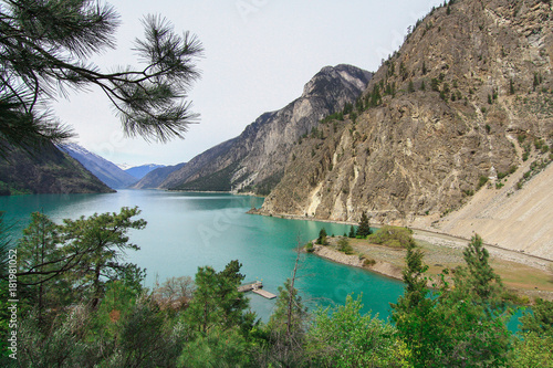 The clean green water of lillooet lake on the foot of mount 