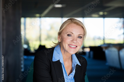 Portrait Of A Mature Businesswoman Smiling At The Camera